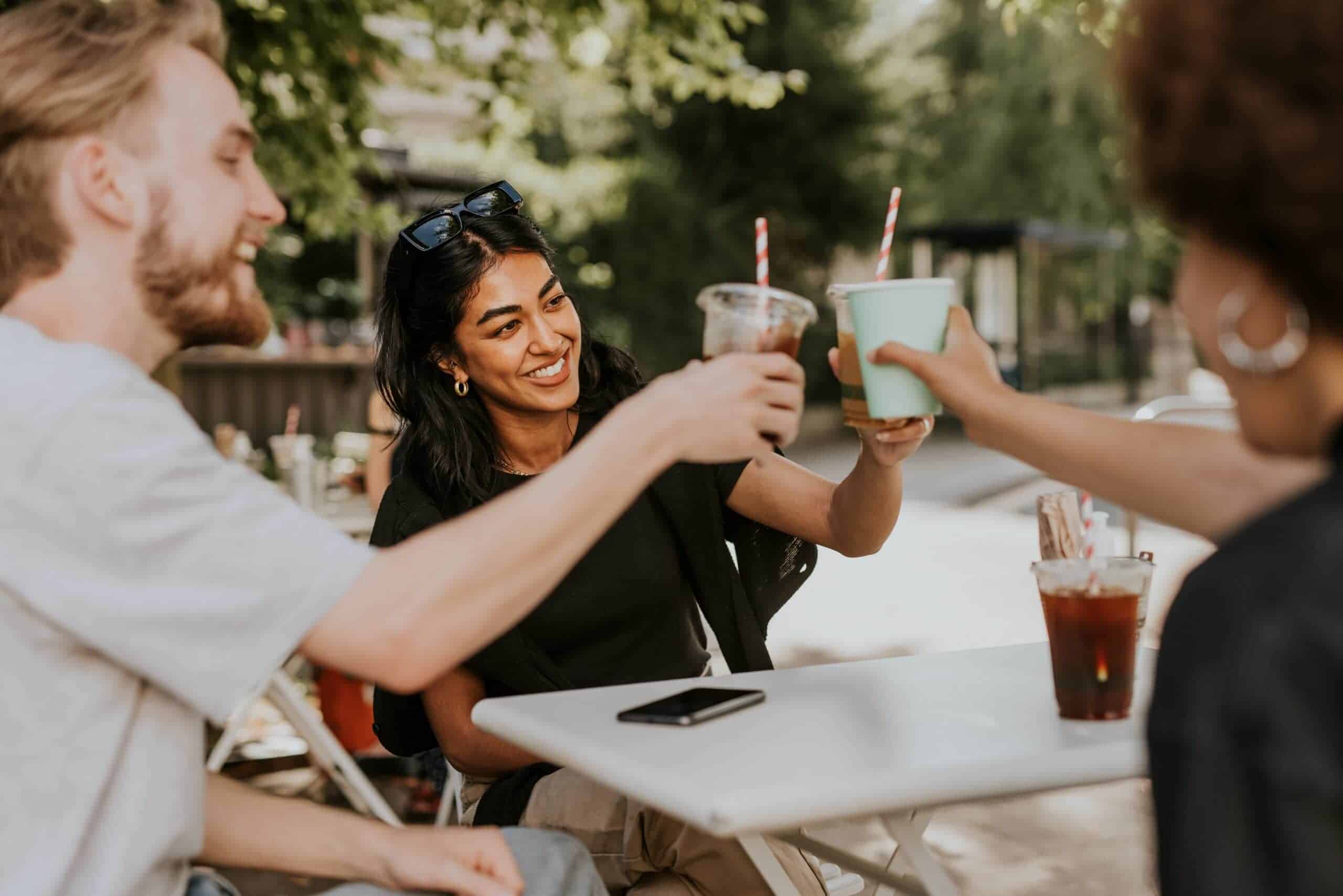 Friends,Having,A,Coffee,And,Talking,At,A,Cafe