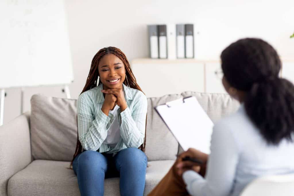 Successful,Psychotherapy.,Millennial,Female,Client,Having,Session,With,Psychologist,,Smiling