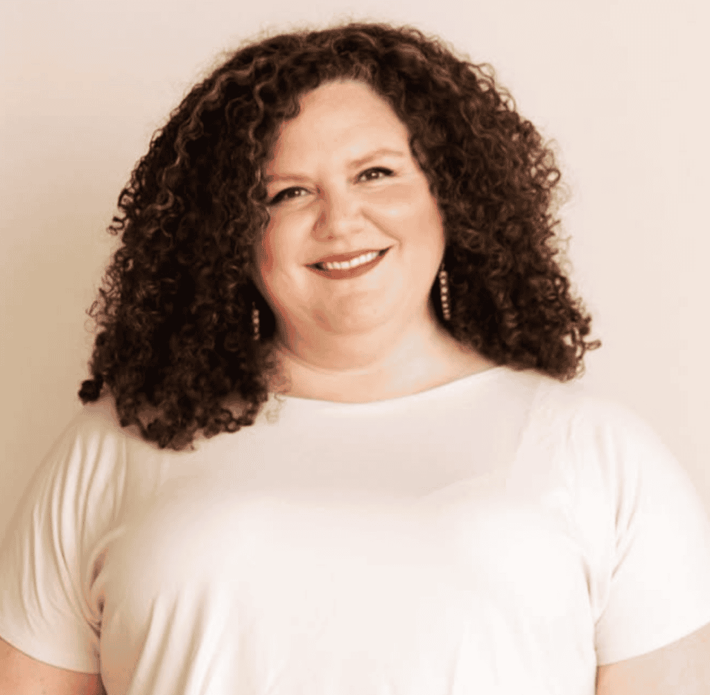 Naomi Finkelstein, C-IAYT smiling in a white top.